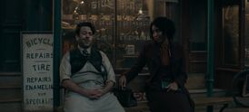 Eulalie Hicks and Jacob Kowalski sit on a bench in New York