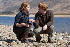 DH1 Ron and Hermione picking up stones