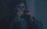 File:Harry Potter examining a shard of the Two-way Mirror given by Sirius Black.jpg (dates to be calculated)
