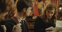 Harry Potter Hermione Granger and Ronald Weasley read the letter from the Queen's Palace