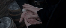 Grindelwald heals Credence's hand.gif