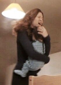 Lily protects Harry.jpg