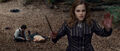 Hermione with bloody hands (and a splinched Ron lying on ground)
