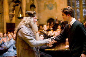 WB-HP-F4-dumbledore-shakes-hand-with-cedric-at-triwizard-naming-ceremony