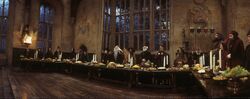 Hogwarts staff singing at the High Table