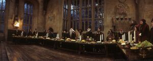 Hogwarts staff singing at the High Table