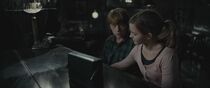 Ron and Hermione playing the piano DHF1