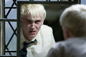 Draco-malfoy-looks-in-the-mirror-600x0-c-default