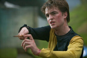 Cedric-with-wand-raised-1050x0-c-default