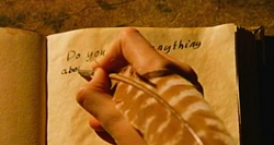  writing a question in 's  with his right hand