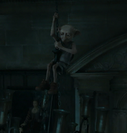 Dobby lostening the chandelier