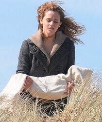 Grief stricken Hermione (Emma Watson) cradling Dobby