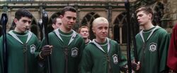 Marcus and the Slytherin Quidditch team antagonising Gryffindor