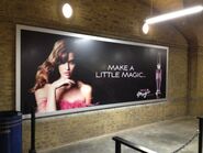 A Divine Magic billboard at King's Cross Station