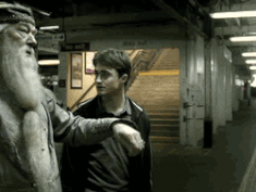 Dumbledore and Harry performing Apparition.gif