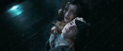 Bellatrix holding Hermione at knifepoint
