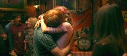 Lavender and Ron snogging in the common room