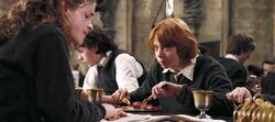 Hermione reading Skeeter's article at breakfast