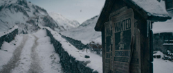 A wanted poster of Grindelwald hangs in Hogsmeade