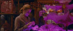 Ginny & Hermione looking at love potions inside Weasleys' Wizard Wheezes HBP