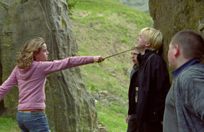 Hermione-with-wand-pointed-at-draco-600x0-c-default
