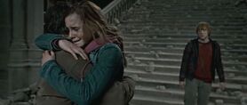 Harry and Hermione hug