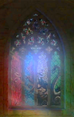 A stained glass window depicting the four Hogwarts mascots at the Entrance Hall.