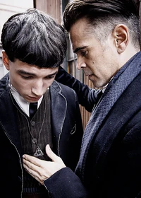  with the  of the  necklace around his neck along with 
