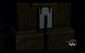 Blood pours out through a wall socket.