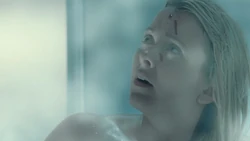 Blood attacks a woman in the shower.