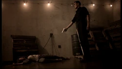 Jenna lies on the ground, dead seconds after Wo Fat has killed her. From the Season 2 episode, "Kil'ilua"- (Deceiver).