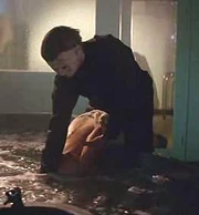 Michael drowns his next victim.