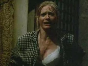 Susan unbuttoning her blouse to lure the creature away from her daughter