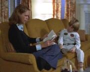 Laurie reads to Tommy