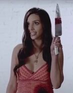Angel Tomlin holding a prop butcher knife in her own hand