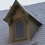 The window of a house which appears to be haunted