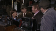 Vernon tries to sell Oscar and Gina the slot machines