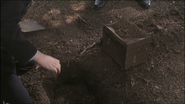 They soon found a metal case buried in the cemetery