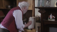 George puts the drawings in a small spot near the fireplace