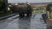 David reverses the half truck down the road