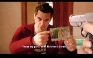 Brad showing Ethan a picture of his daughters
