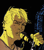 John Constantine singing into a microphone