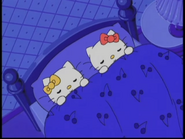 Kitty and Mimmy sleeping in bed