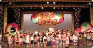 Sanrio Puroland guests dancing along on stage during a public recording.