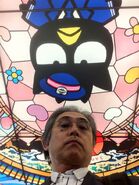 Hisato underneath Badtz-Maru who is displayed on the ceiling above him.