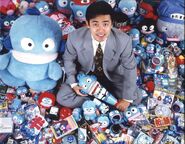 Hisato surrounded by Hangyodon merchandise.