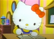 Kitty writing in a book