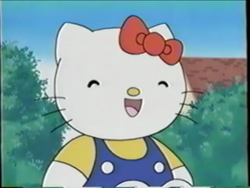 Kitty sitting down in the sun.png