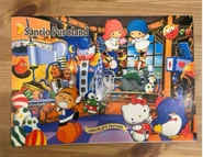 A notebook cover shows Tabo, Keroppi, Kiki and Lala, Hello Kitty, and Tuxedo Sam at Chocolate Factory