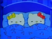 Hello Kitty and her sister Mimmy sleeping in bed